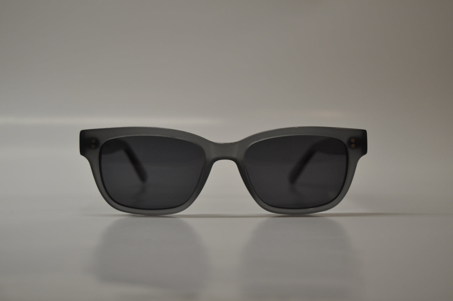 A pair of yellow-framed sunglasses with polarized lenses, displayed against a neutral background.