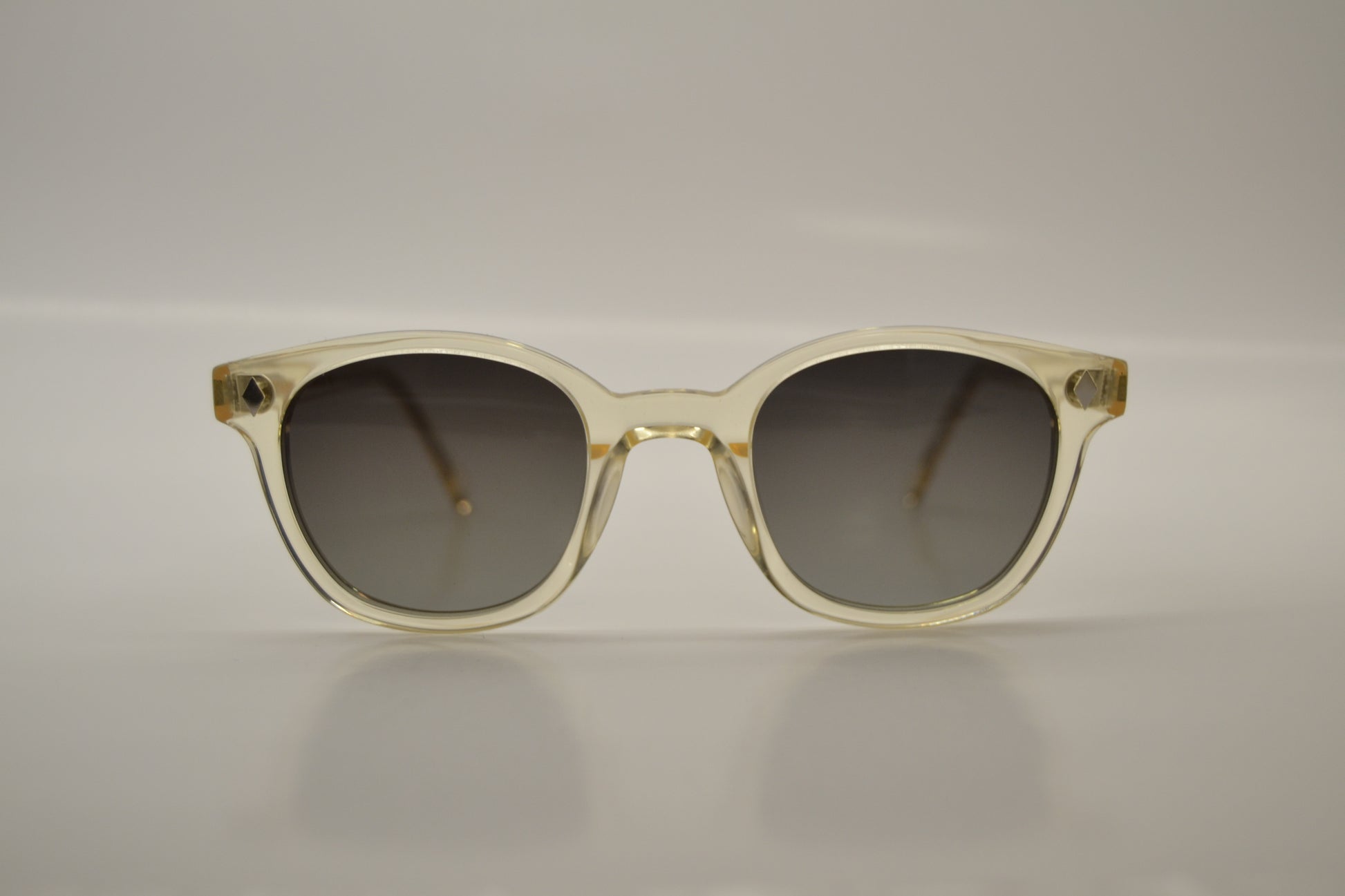 A pair of black sunglasses with a full plastic frame, polarized lenses, and UV protection.