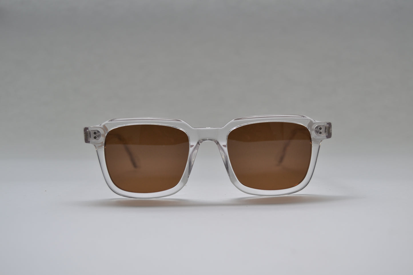A pair of square-shaped, full frame metal sunglasses with polarized lenses and UV protection.
