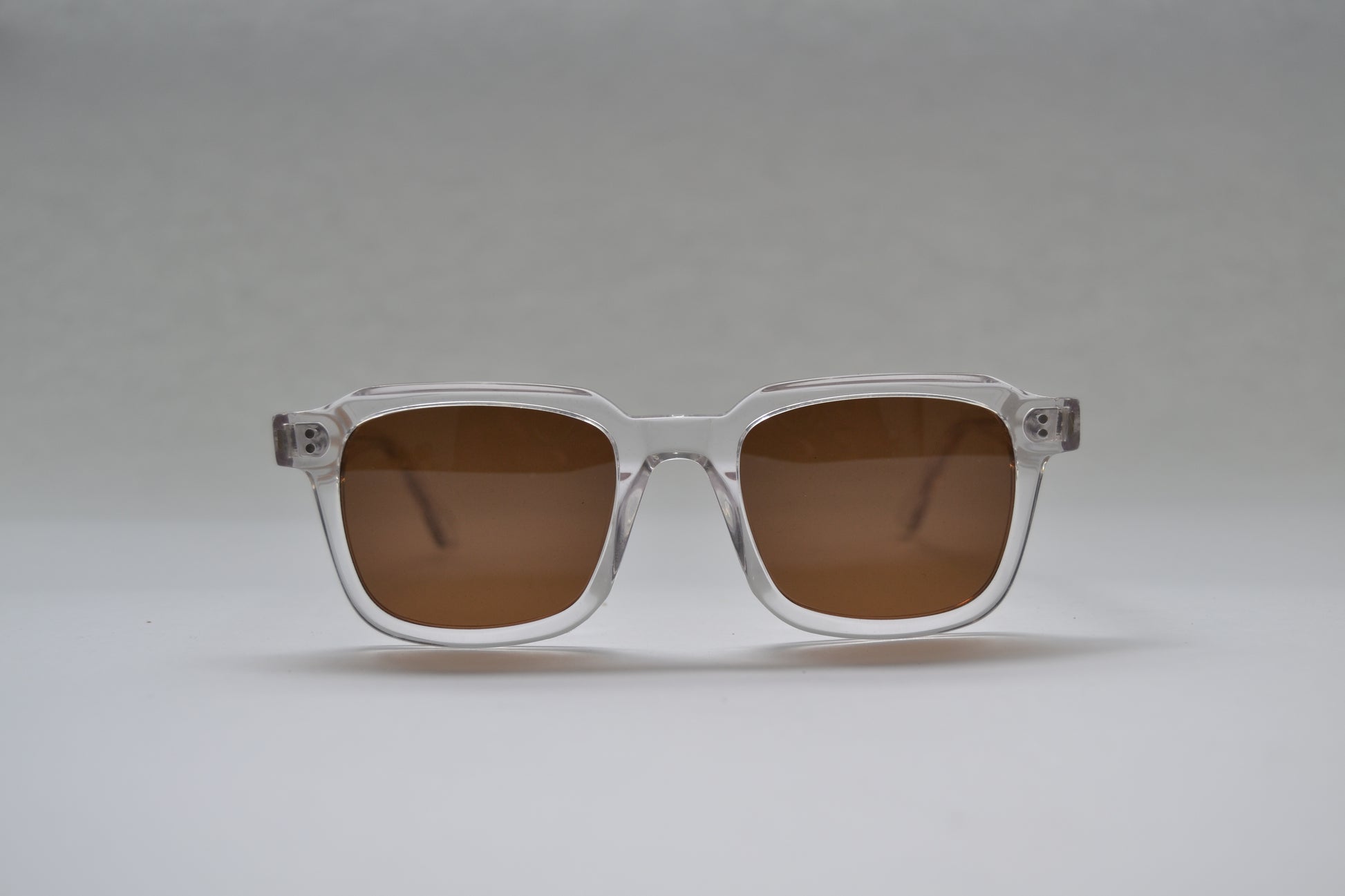 A pair of square-shaped, full frame metal sunglasses with polarized lenses and UV protection.