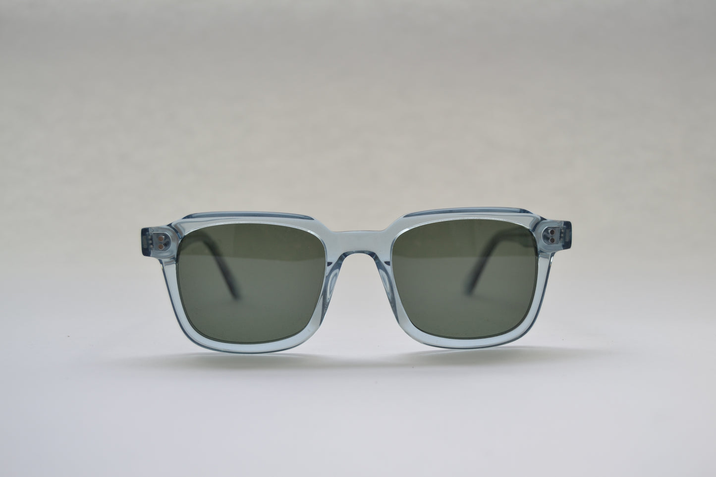 A pair of square-shaped, full frame metal sunglasses with polarized lenses and UV protection.